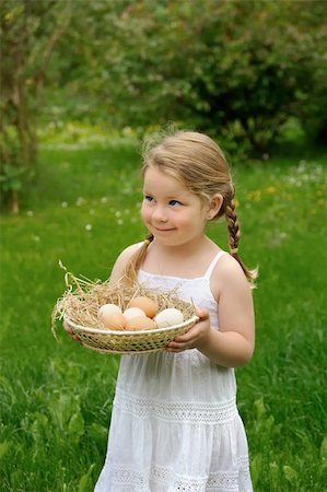 people eating eggs - Little girl holding eggs Stock Photo - Budget Royalty-Free & Subscription, Code: 400-04279566