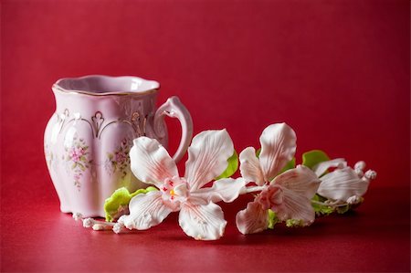 simsearch:400-04232483,k - The cup of green tea with caramel orchid on red background Stock Photo - Budget Royalty-Free & Subscription, Code: 400-04279780