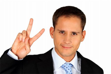 A young and handsome business man signalling success by making a V shape with his fingers Stock Photo - Budget Royalty-Free & Subscription, Code: 400-04270369