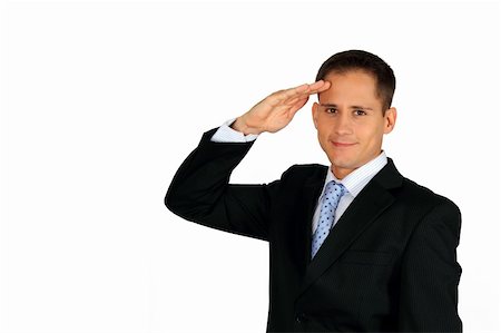 simsearch:400-06091141,k - A young and handsome business man saluting signalling loyalty and service, or a connection with the military. Photographie de stock - Aubaine LD & Abonnement, Code: 400-04270371