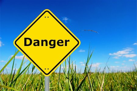danger written on a yellow road warning sign Stock Photo - Budget Royalty-Free & Subscription, Code: 400-04270745