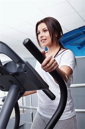 simsearch:673-02140416,k - The young girl on a exercise machine close up Photographie de stock - Aubaine LD & Abonnement, Code: 400-04270902