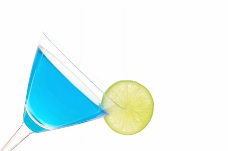drink martini glass fruits white background - cocktail drink with Curacao and copyspace isolated on white background Stock Photo - Budget Royalty-Free & Subscription, Code: 400-04271603