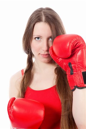 Woman wearing boxing gloves over white background Stock Photo - Budget Royalty-Free & Subscription, Code: 400-04271738