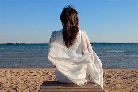 simsearch:400-08314022,k - woman in white dress back sitting on beach by sea Stock Photo - Budget Royalty-Free & Subscription, Code: 400-04271944