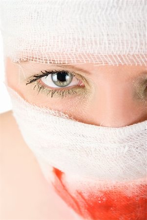 plastic wrap person - woman with bandages with blood on her face Stock Photo - Budget Royalty-Free & Subscription, Code: 400-04271959