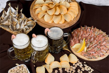 Beer and snacks set of chips, pistachio, shrimp and fish Stock Photo - Budget Royalty-Free & Subscription, Code: 400-04271964