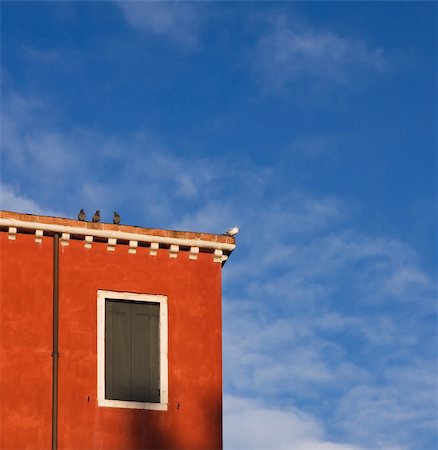 The part of red painted house with birds on the roof, Venice, Italy Stock Photo - Budget Royalty-Free & Subscription, Code: 400-04272047