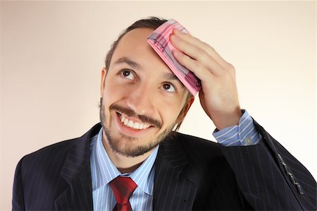 simsearch:400-08786732,k - The businessman wipes a forehead by kerchief Foto de stock - Super Valor sin royalties y Suscripción, Código: 400-04272085