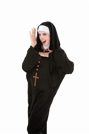 Young, attractive Catholic nun dancing on a white background Stock Photo - Budget Royalty-Free & Subscription, Code: 400-04272334