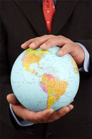 simsearch:400-05716348,k - Businessman holding Earth globe in his hands Foto de stock - Super Valor sin royalties y Suscripción, Código: 400-04272360