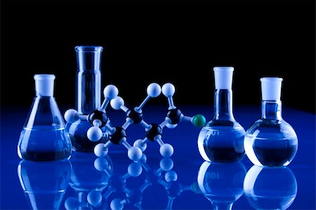 fikmik (artist) - Laboratory Glassware in blue table in laboratory Foto de stock - Royalty-Free Super Valor e Assinatura, Número: 400-04273458