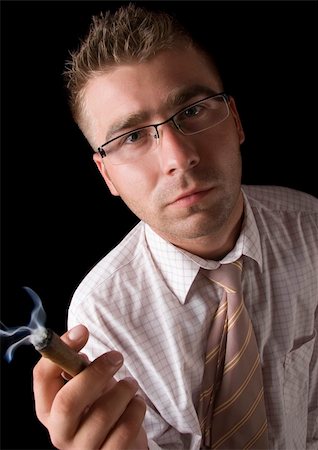 Businessman smoking cigar Stock Photo - Budget Royalty-Free & Subscription, Code: 400-04273820