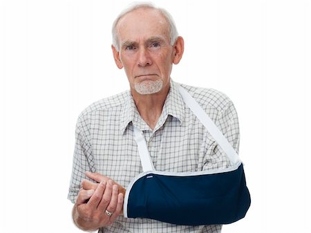 Old man with injured arm in sling after accident. Pain shows on face.  Isolated on white. Photographie de stock - Aubaine LD & Abonnement, Code: 400-04284574