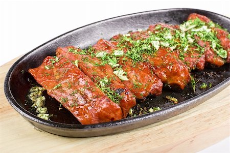 slab of roast - Spare ribs and greens closeup for dinner at pan isolated on a white Stock Photo - Budget Royalty-Free & Subscription, Code: 400-04284610