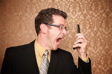 Angry Business Man Shouting at His Phone Stock Photo - Budget Royalty-Free & Subscription, Code: 400-04284705