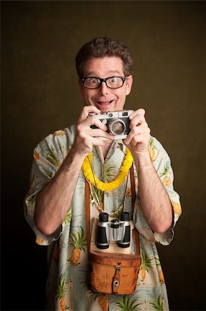 Nerdy pacific island tourist with a silly grin, camera and binoculars Stock Photo - Budget Royalty-Free & Subscription, Code: 400-04284707