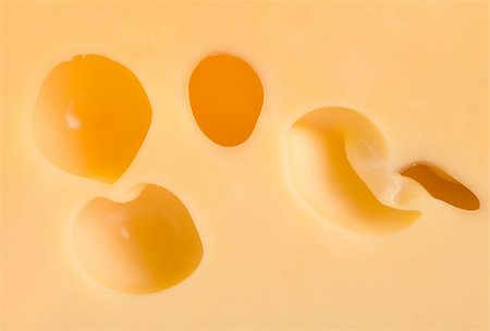 emmentaler cheese - Close-up of a cheese loaf whith holes Stock Photo - Budget Royalty-Free & Subscription, Code: 400-04284789