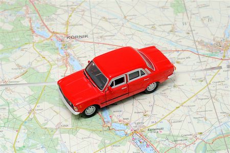 simsearch:400-07102775,k - Tiny red car model on the road map Stock Photo - Budget Royalty-Free & Subscription, Code: 400-04284783