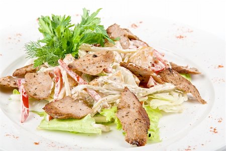 simsearch:400-04307416,k - Tasty salad of meat and vegetable dish close up on a white background Foto de stock - Super Valor sin royalties y Suscripción, Código: 400-04285811