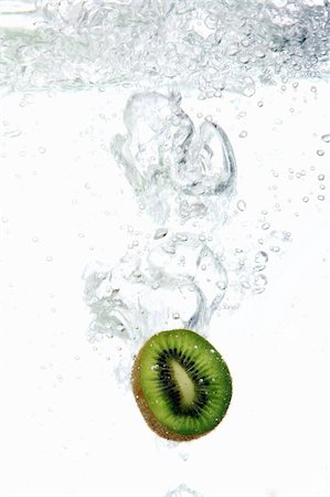 Fresh kiwi dropped into water Stock Photo - Budget Royalty-Free & Subscription, Code: 400-04285965