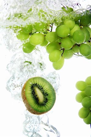 Fresh kiwi and vine grape dropped into water Stock Photo - Budget Royalty-Free & Subscription, Code: 400-04285966