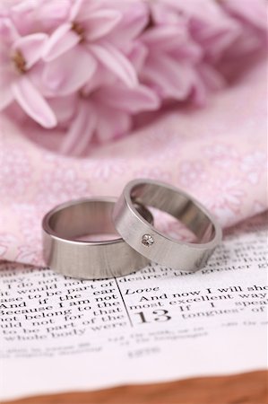 simsearch:400-04286012,k - Titanium wedding rings on the Bible open to 1st Corinthians 13, a passage about love. Shallow dof Stock Photo - Budget Royalty-Free & Subscription, Code: 400-04286013