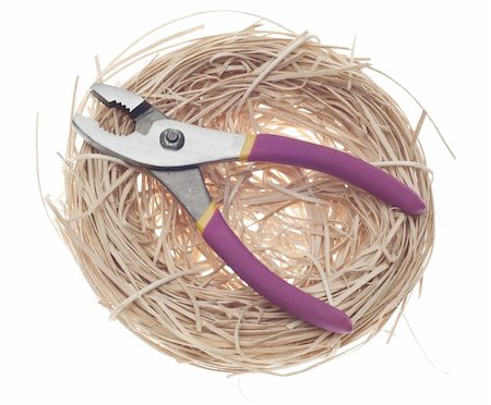 Home Building Concept with Wrench in a Nest Isolated on White with a Clipping Path. Stock Photo - Budget Royalty-Free & Subscription, Code: 400-04286262