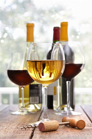 simsearch:400-07829164,k - Glasses of white and red wine on wooden table Stock Photo - Budget Royalty-Free & Subscription, Code: 400-04286331