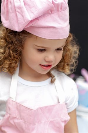 rolling over - Portrait of a little chef at home Stock Photo - Budget Royalty-Free & Subscription, Code: 400-04286986