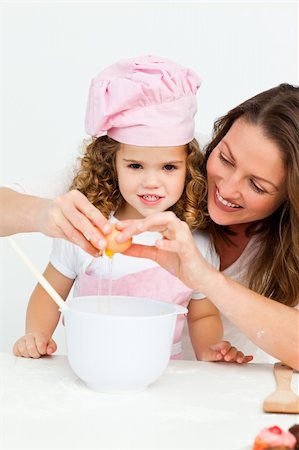 simsearch:400-05749772,k - Mother showing her daughter how to break eggs in the kitchen Stock Photo - Budget Royalty-Free & Subscription, Code: 400-04286994