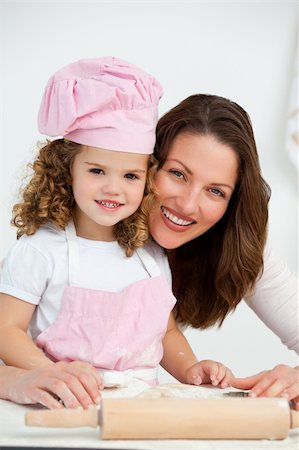 simsearch:400-05749772,k - Portrait of a mother and daughter at a table in the kitchen Stock Photo - Budget Royalty-Free & Subscription, Code: 400-04287003