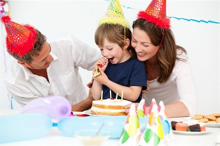 simsearch:400-04311221,k - Happy parents celebrating their son's birthday at home Photographie de stock - Aubaine LD & Abonnement, Code: 400-04287029