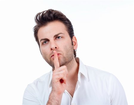 man in white shirt doing a silence gesture with forefinger - isolated on white Foto de stock - Super Valor sin royalties y Suscripción, Código: 400-04287746