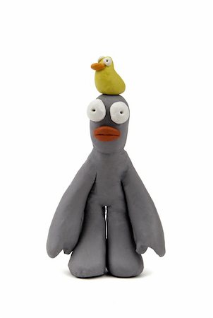 shocked face animal - Plasticine man with yellow bird on his head Stock Photo - Budget Royalty-Free & Subscription, Code: 400-04288387