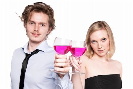 Young couple toasting with pink drink. Two people drinking. Studio photo, isolated. Stock Photo - Budget Royalty-Free & Subscription, Code: 400-04288763