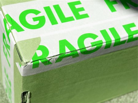 Detail of a fragile corrugated cardboard packet Stock Photo - Budget Royalty-Free & Subscription, Code: 400-04288855