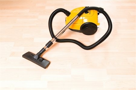 simsearch:400-04640043,k - Vacuum cleaner on the polished wooden floor Stock Photo - Budget Royalty-Free & Subscription, Code: 400-04288896
