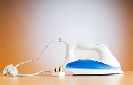 simsearch:400-04225746,k - Modern electric iron against the colorful background Stock Photo - Budget Royalty-Free & Subscription, Code: 400-04288913