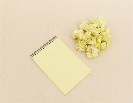 Notebook and crumpled paper on wooden table Stock Photo - Budget Royalty-Free & Subscription, Code: 400-04289093