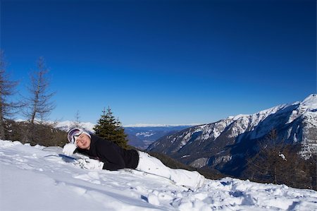 simsearch:400-04289173,k - Cute tired snowboarder is resting on her snowboard Stock Photo - Budget Royalty-Free & Subscription, Code: 400-04289184