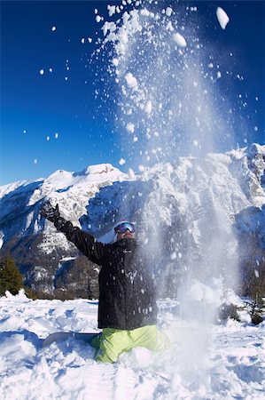 simsearch:400-04256964,k - Adult guy throwing snow in the air in high mountains Stock Photo - Budget Royalty-Free & Subscription, Code: 400-04289189