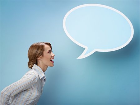 speech bubble with someone thinking - mid adult business woman screaming in blank speech bubble on blue background. Horizontal shape, side view, waist up, copy space Stock Photo - Budget Royalty-Free & Subscription, Code: 400-04280176