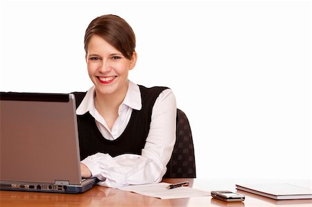 simsearch:400-05732500,k - Young happy business woman sits on desk and works on laptop. Isolated on white background. Foto de stock - Royalty-Free Super Valor e Assinatura, Número: 400-04280477