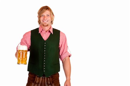 simsearch:400-04680527,k - Bavarian man with leather trousers (lederhose) holds oktoberfest beer stein in hand. Isolated on white background. Stockbilder - Microstock & Abonnement, Bildnummer: 400-04280492