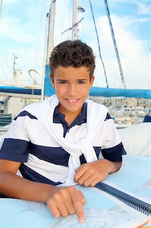 boy teen sailor sitting on marina boat chart map smiling in summer vacation Stock Photo - Budget Royalty-Free & Subscription, Code: 400-04280664