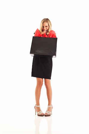 Young woman in black with red and black shopping bag Stock Photo - Budget Royalty-Free & Subscription, Code: 400-04281466