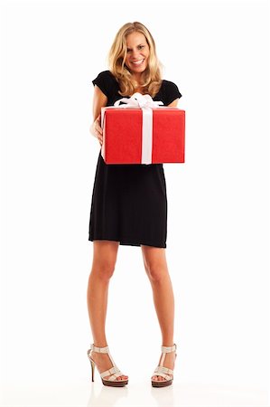 simsearch:400-04759494,k - Young woman in black holding red wrapped present Stock Photo - Budget Royalty-Free & Subscription, Code: 400-04281486