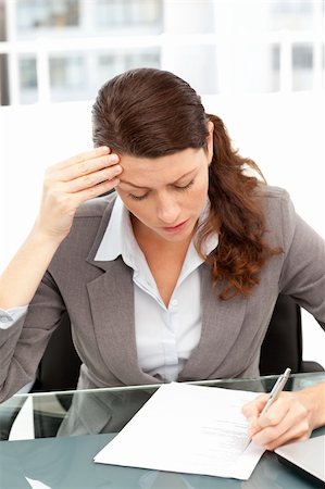 simsearch:400-04562604,k - Worried businesswoman working at a table in her office Photographie de stock - Aubaine LD & Abonnement, Code: 400-04281571