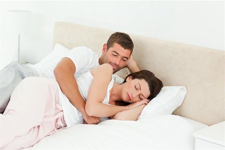 simsearch:400-05749442,k - Passionate man looking at his girlfriend sleeping peacefully together in the bedroom Photographie de stock - Aubaine LD & Abonnement, Code: 400-04281597